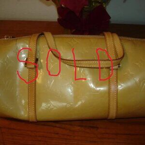 Auth. Louis Vuitton yellow patent Bedford
